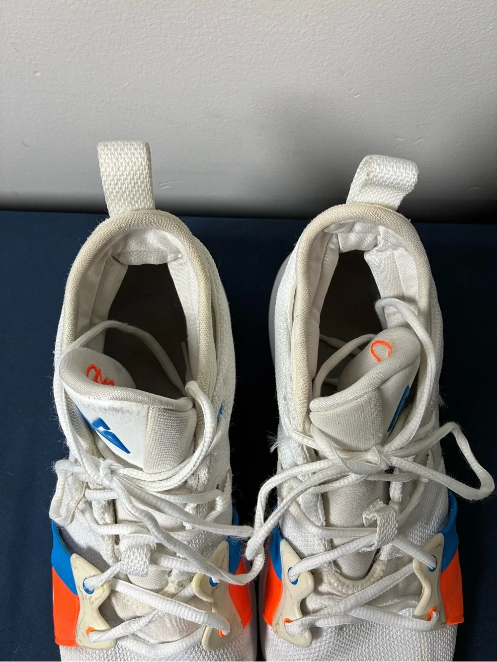 Nike White Youth Athletic Sneakers with Blue & Orange Accents